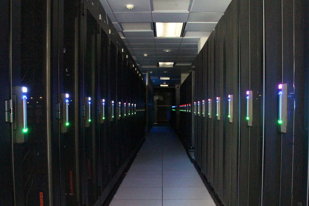 An aisle lined with racks in SDSC's Colocation facility.