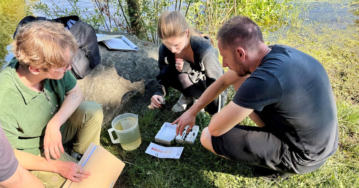 Research students test groundwater in the field.